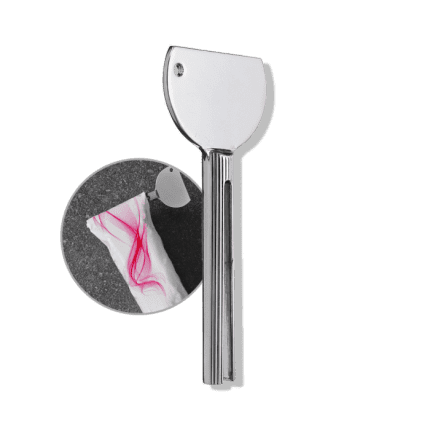 A shiny silver Hair Color Tube Squeezer with a round head and grooved handle is shown, with an inset illustrating its use to squeeze hair color tubes or remove gum from tissue on a gray surface.