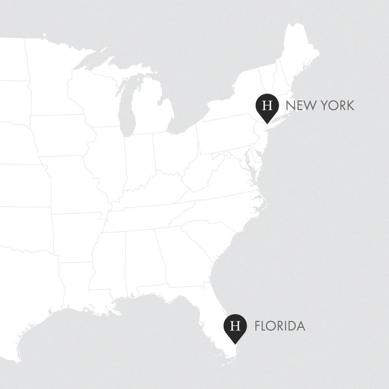 A minimalist map of the eastern United States shows two labeled points: one in New York, highlighting Hair Bar NYC, and one in southern Florida. Each point features a black marker with a white H and a bold state name label.