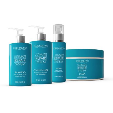 The teal-colored Ultimate Repair System Duo Bundle from Hair Bar NYC is displayed, featuring a shampoo and conditioner with pumps. Both have white and gold text.