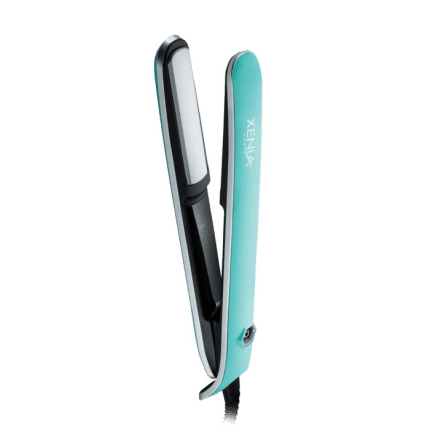 A turquoise and black Sleek Flat Iron 1" hair straightener with ceramic plates, a visible power button by the handle, and the XENLUX logo printed on the side stands partially open on a light gray background.